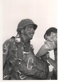solider with parachute pack sepia photo