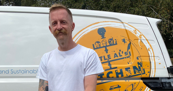 person stood in front of a food van