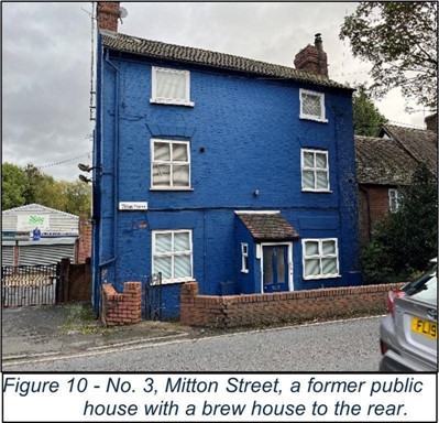 large blue painted old brick building