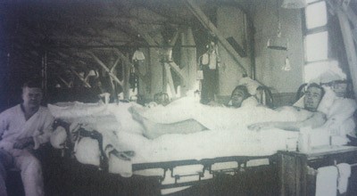 black and white photo of military hospital ward