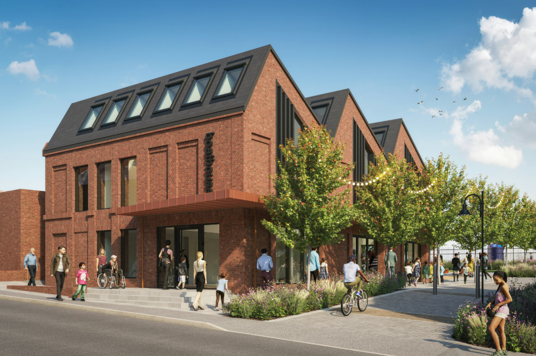 Red brick building with grey fin shaped roof