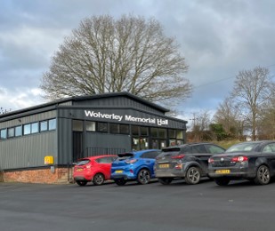 exterior of new looking village hall and car park