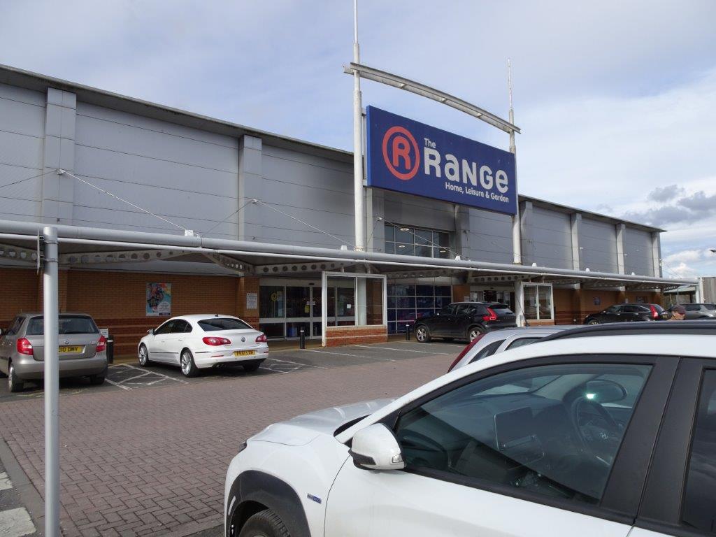 Front of a big retail store. Signage say The Range.