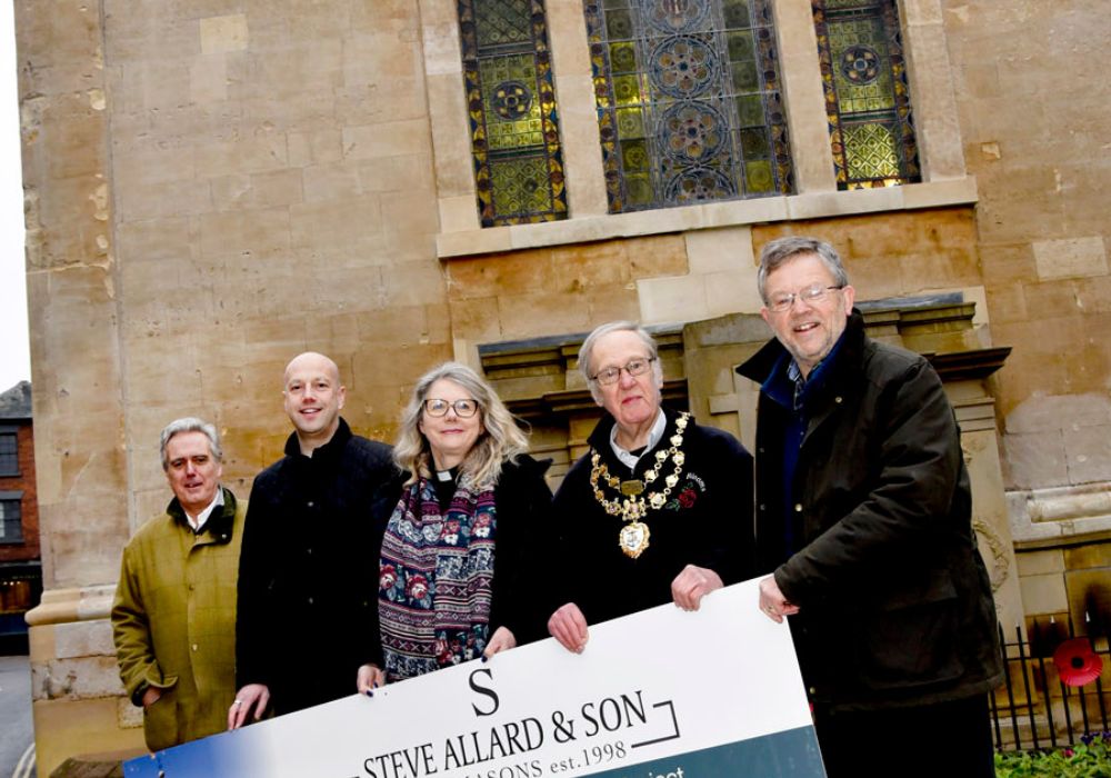 Five people stood in a line in front of St Anne's Church, Bewdley.
